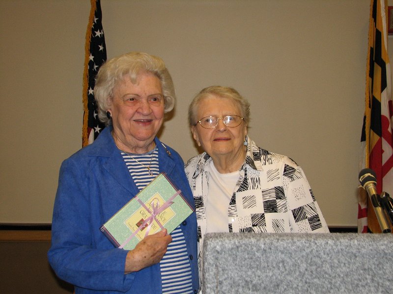 IMG_5394.JPG - Nell Reid, Past President of the Leisure World Kiwanis Club is honored as their “Unsung Hero” by President Anna Lee Crockett at the DCM.  The Leisure World club hosts many events for Division 17 including the monthly Division Council Meetings, the Official Visit of the CDK Governor, Key Club monthly President Council Meetings for 19 Key Club Division 17A and 17B as well and the annual Service Leadership Award Dinner and often the Potomac Region’s Mid Winter Conferences.  Nell is there at most all of those events, as is Anna Lee.  This is a very active Kiwanis Clubs.  Thanks form all the Division 17 members for your leadership.